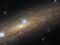 «Хаббл» показал галактику, которая «лежит на боку»