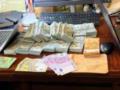 У задержанных утром должностных лиц Нацполиции изъяли 22 млн грн и автомобили