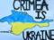 В Севастополе задержали женщину за проукраинские надписи на заборе